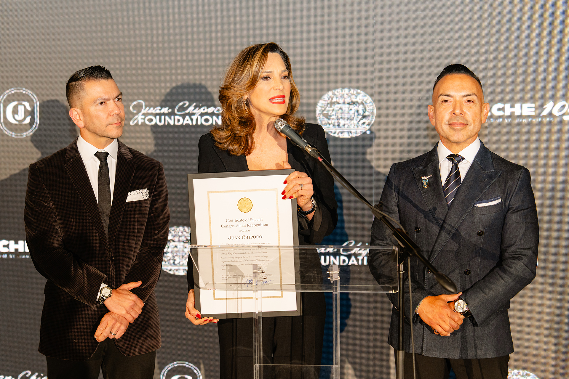 Photo of Juan Chipoco receiving the special congressional recognition