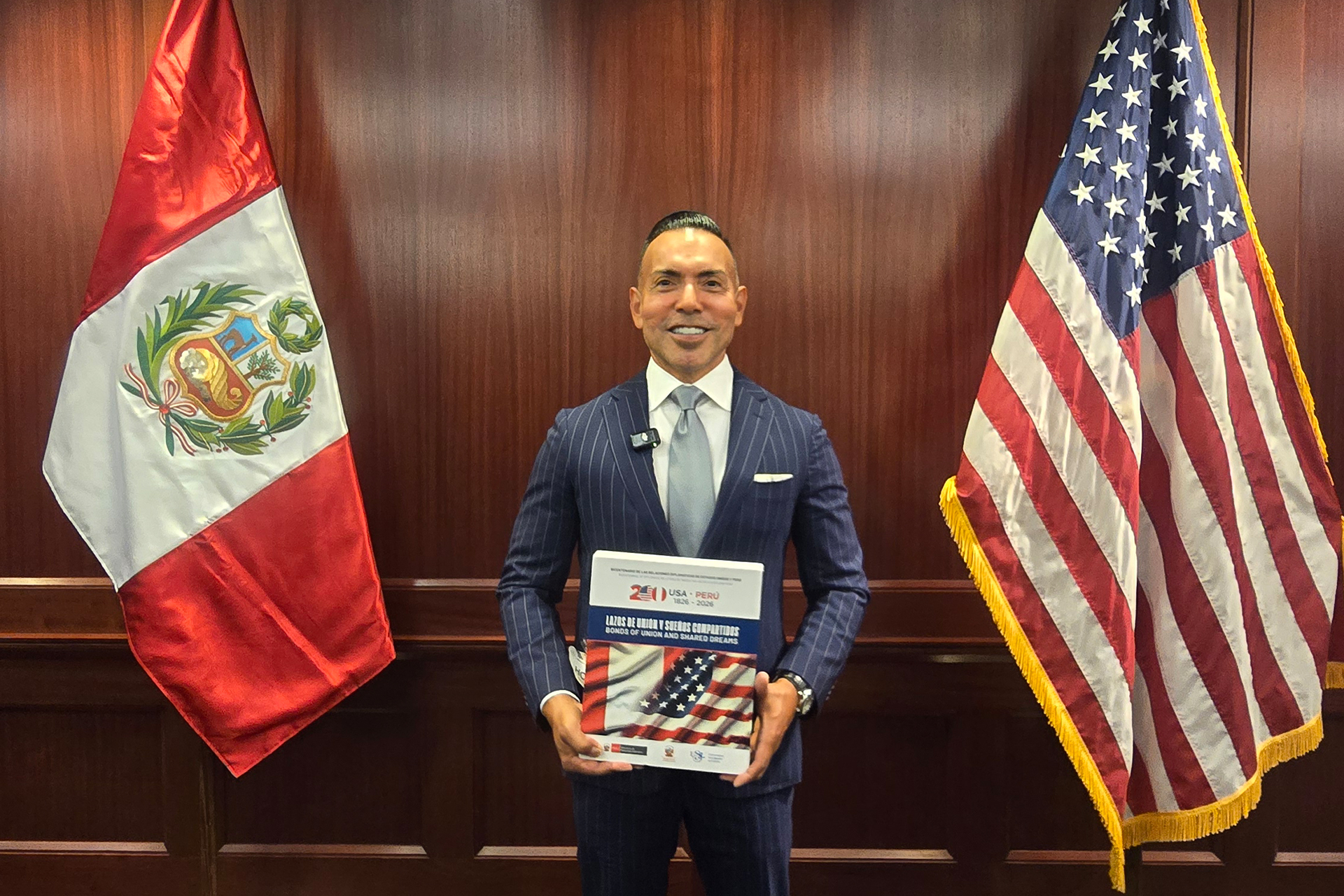 Photo of Juan Chipoco receiving Marca Peru recognition